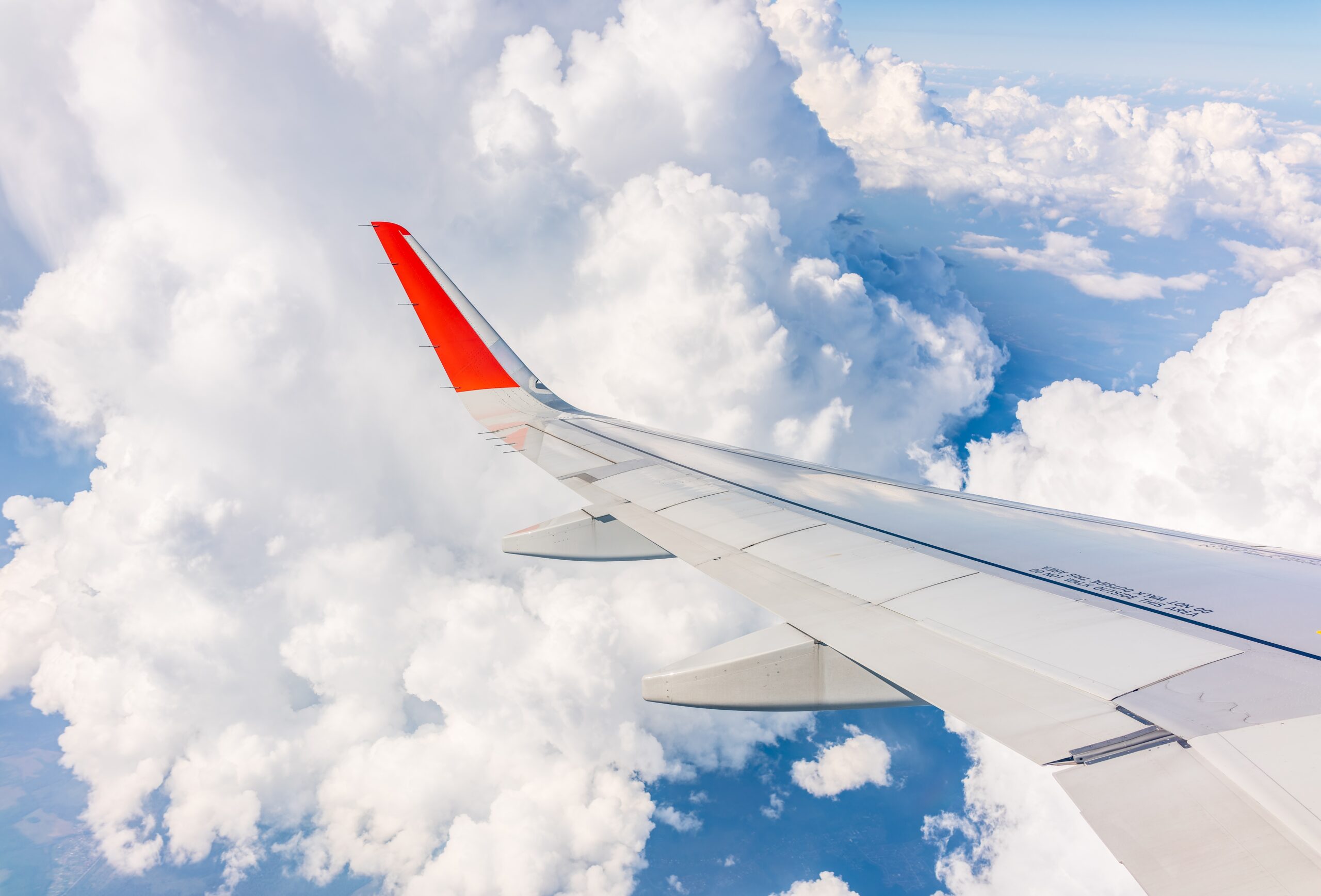 View,From,The,Airplane,Window,At,A,Beautiful,Cloudy,Sky